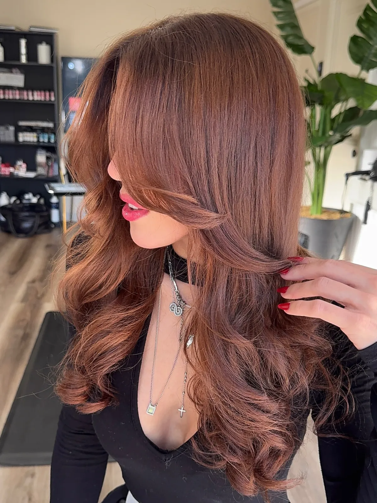 Glossy auburn hair with soft layers