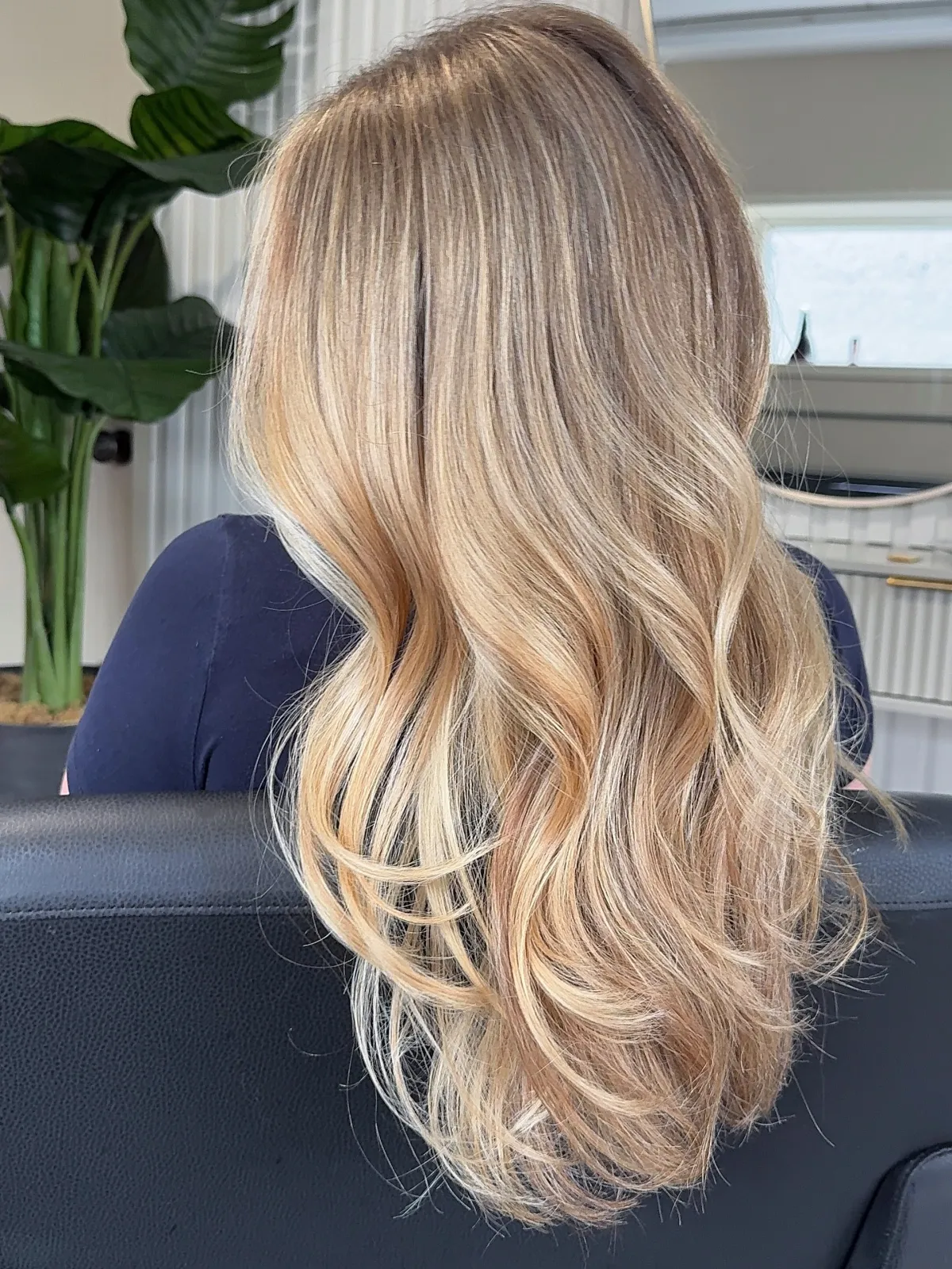 Bright blonde balayage with soft, loose waves