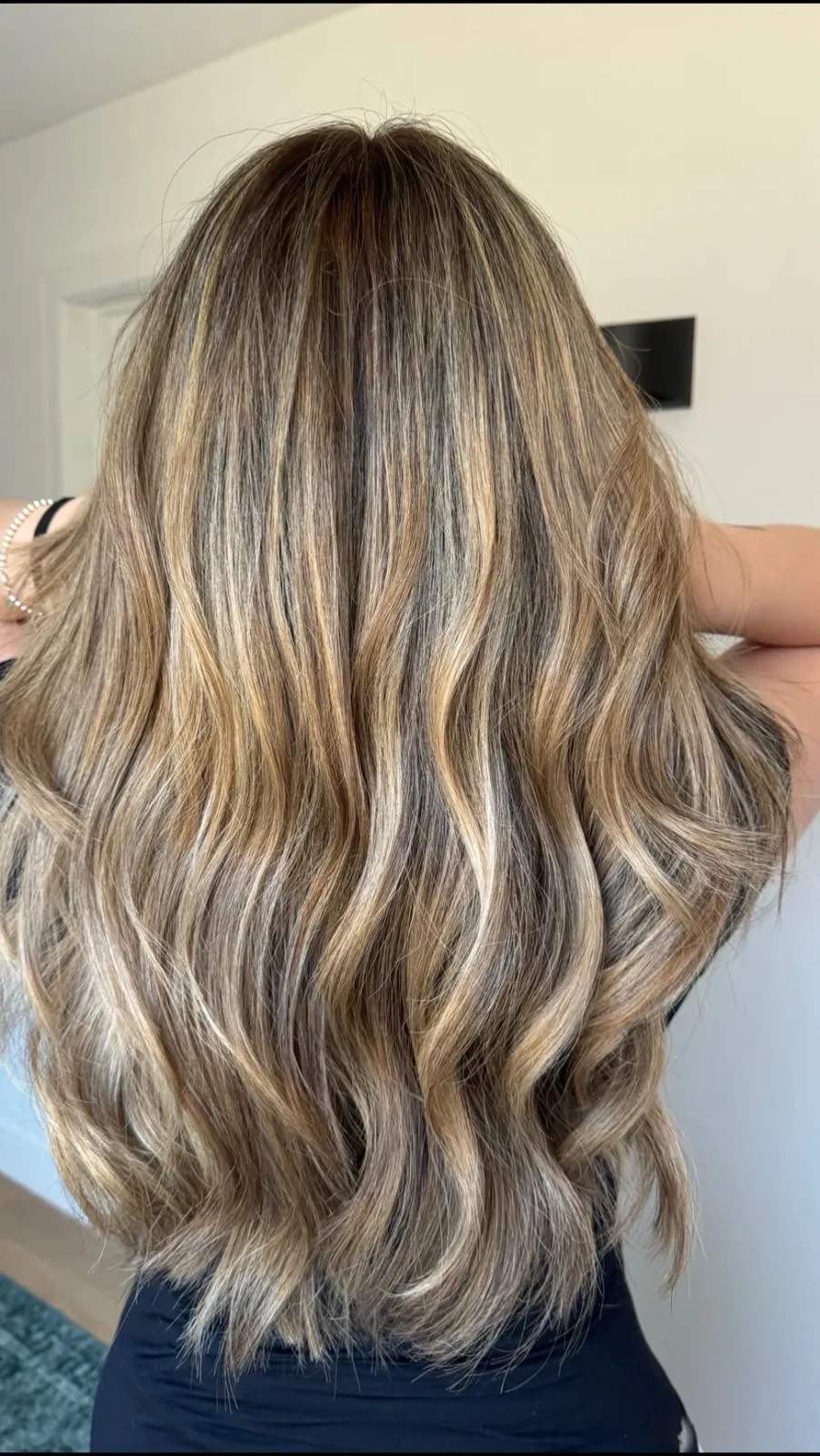 Dimensional blonde with darker roots and bright ends