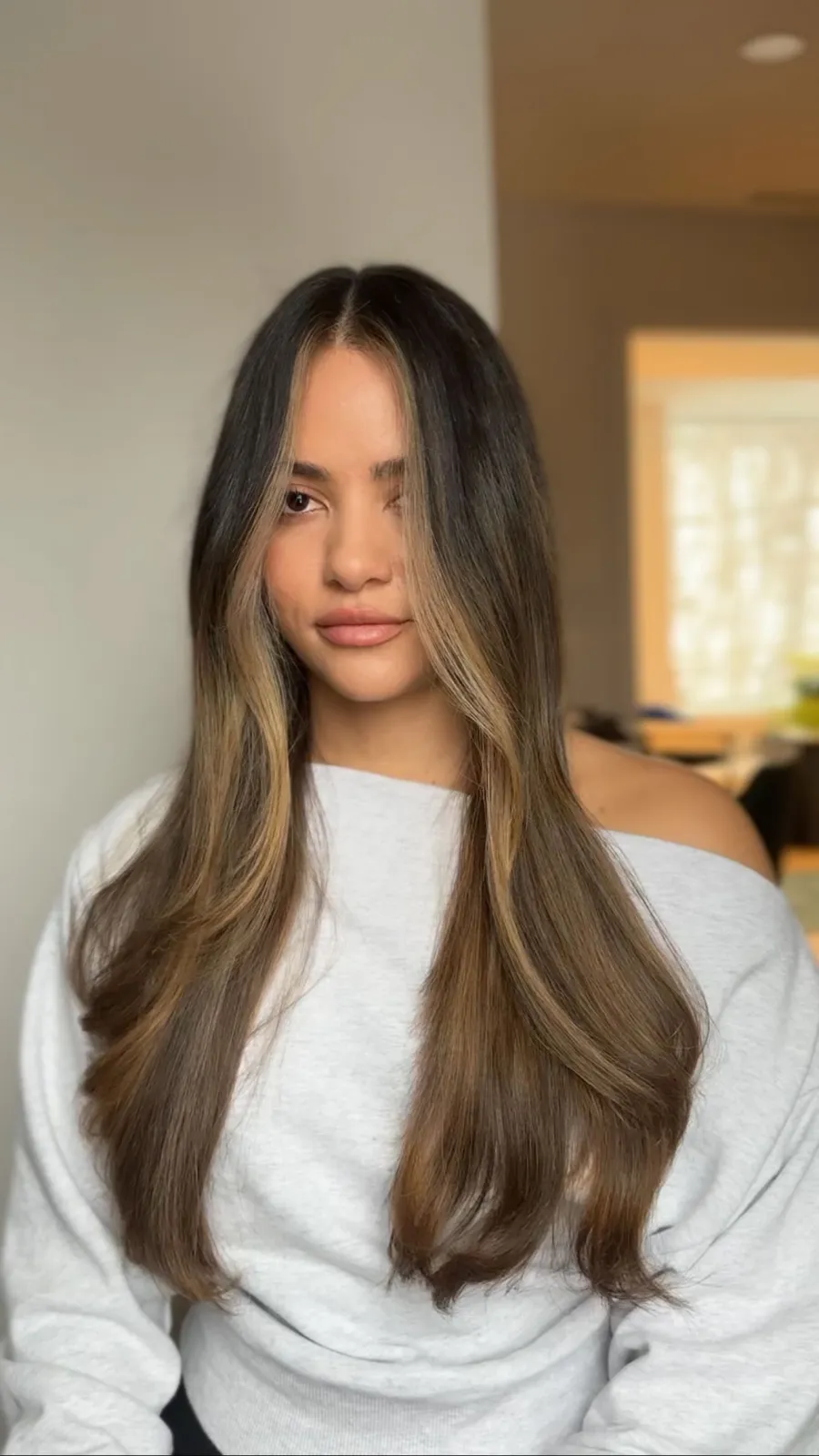 Brunette with bright face-framing highlights